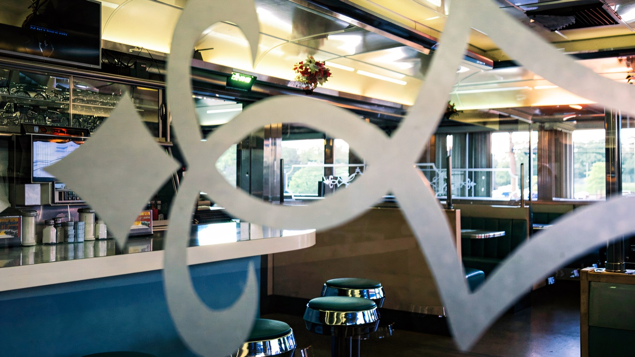 The retro chrome-and-blue American diner where you refuel between games