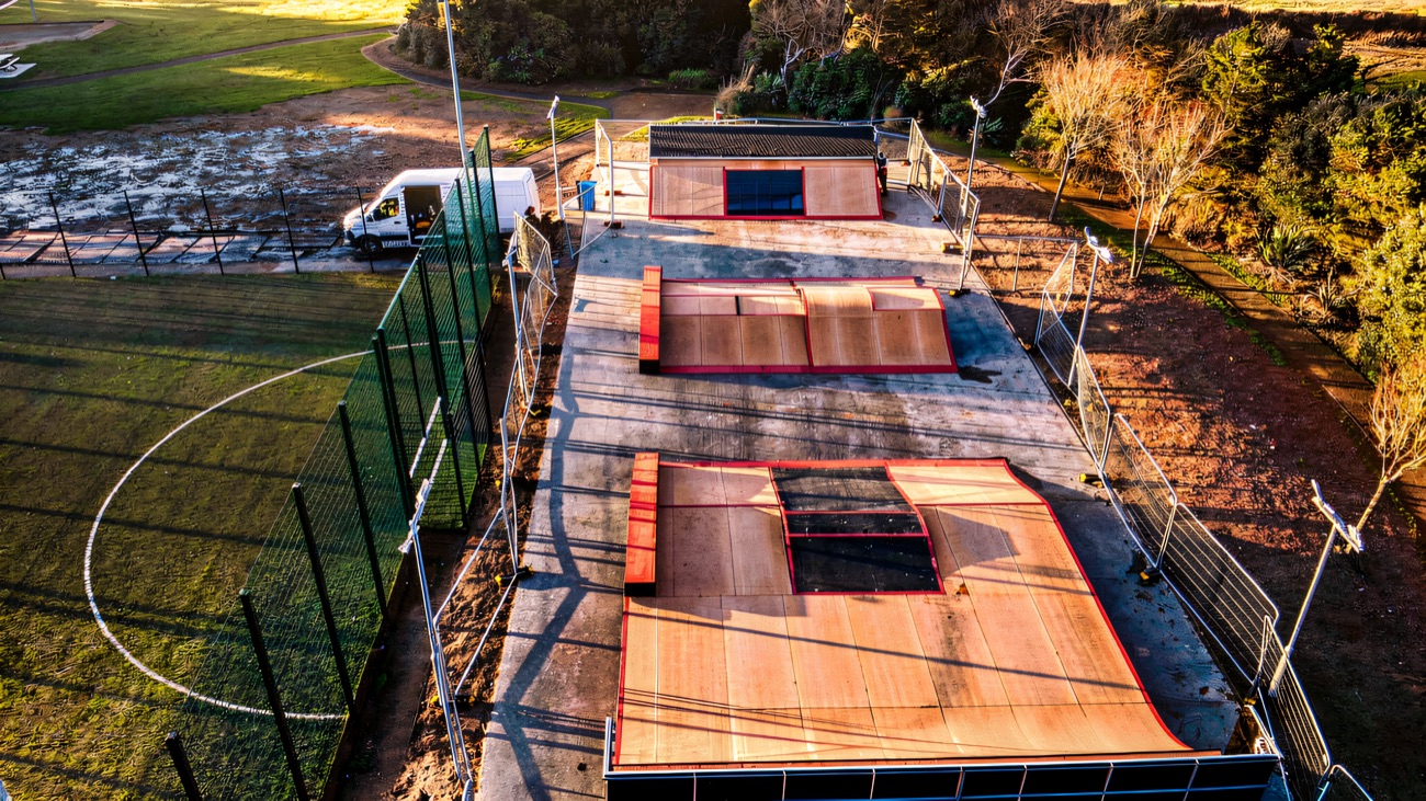 Overhead view of the three ramp sections laid out beside the all-weather pitch