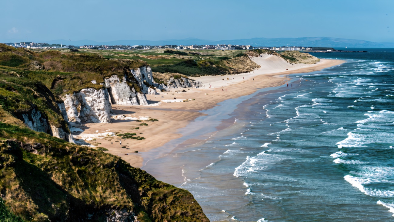 The white cliffs and beach sweeping back toward Portrush