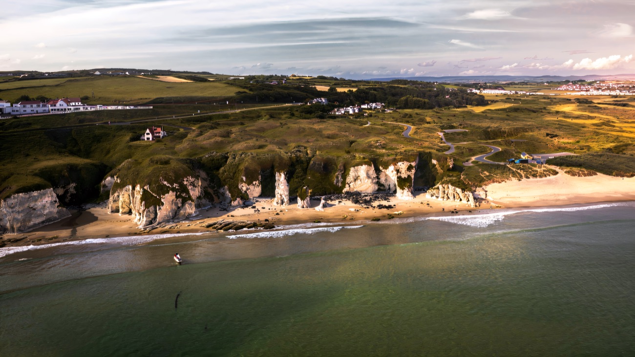 The white headlands and strand seen from the air