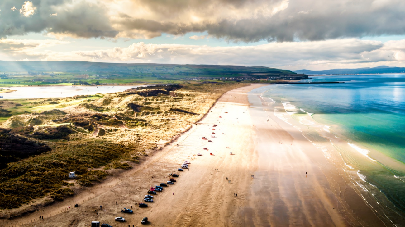 The two-mile strand from above, dunes on one side and Atlantic on the other
