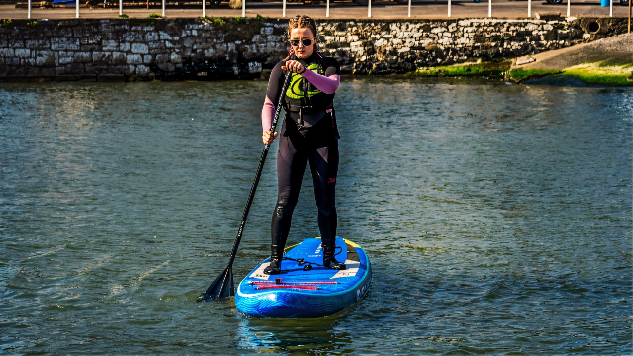 Paddling out from the harbour wall onto calm water