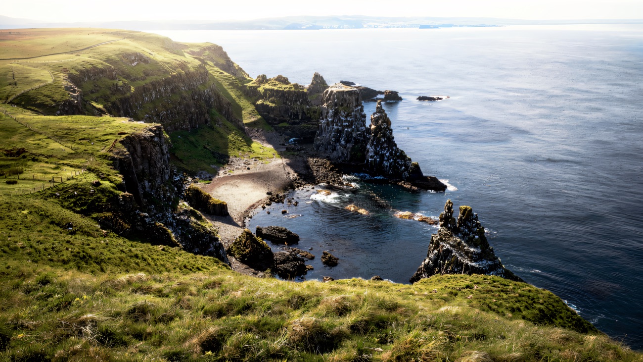 The rugged sea stacks and green cliffs of the Rathlin coastline.