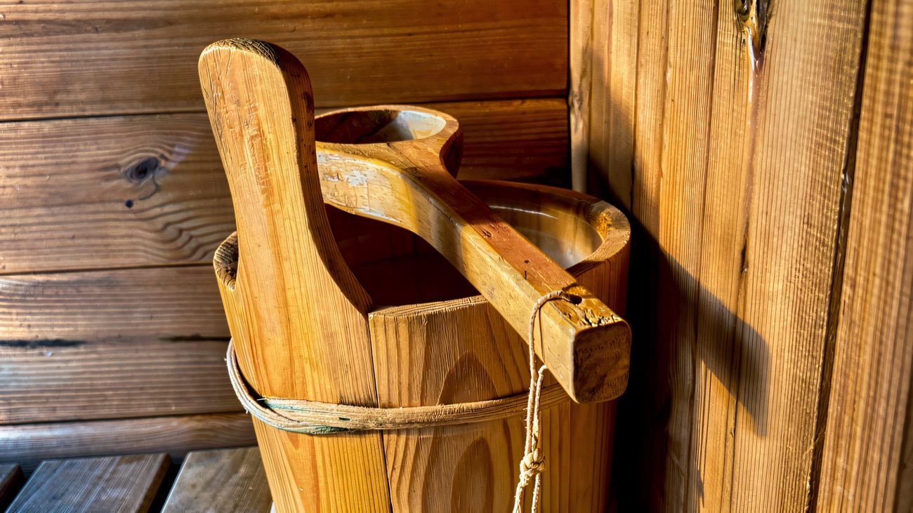 Wooden ladle and bucket ready on the bench