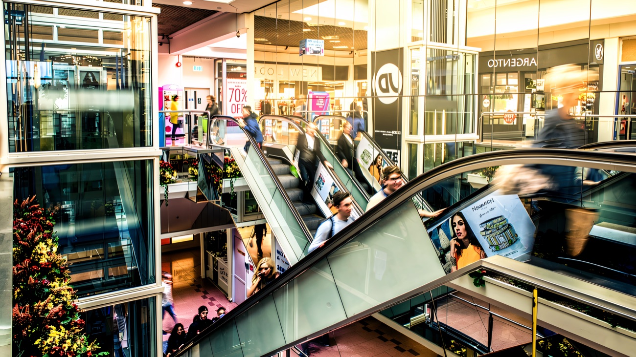 The multi-level interior of the Richmond Centre, with escalators and glass lifts linking the shopfronts across the split-level floors