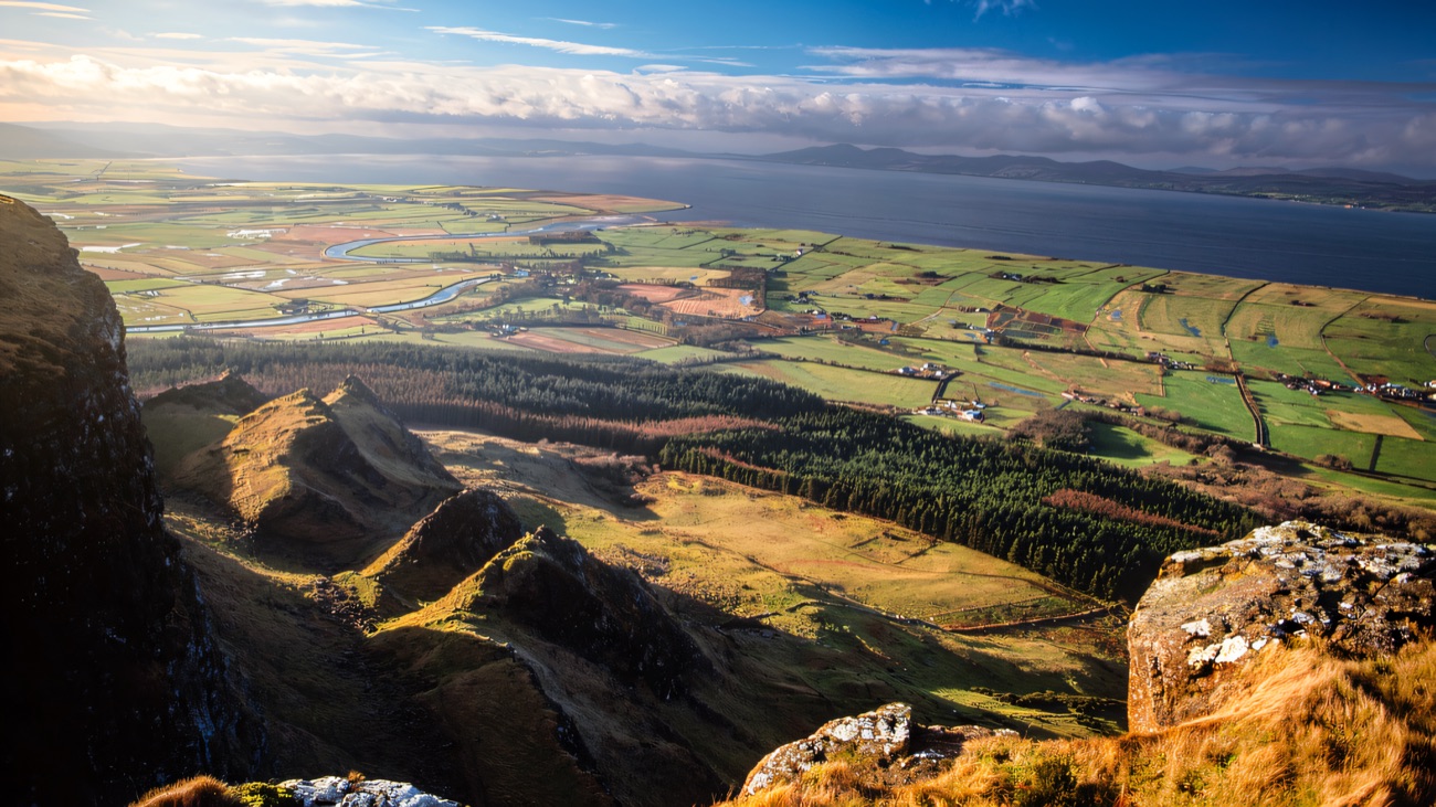 A sweeping view from Binevenagh over the winding Roe and the shining expanse of Lough Foyle.