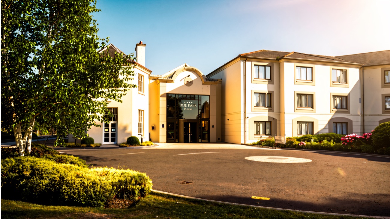 The front entrance of the Roe Park Resort hotel on a bright day