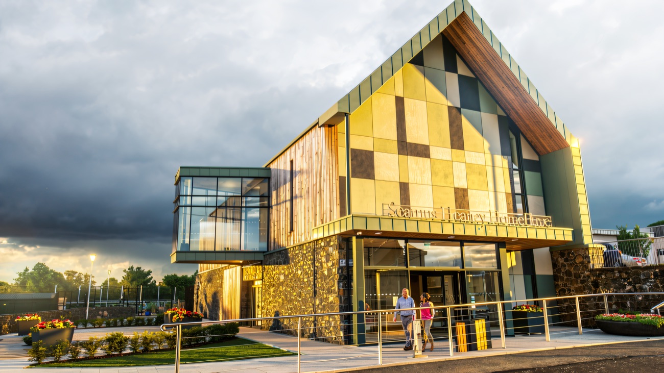 The main entrance, its name spelled out beneath the pitched timber-and-tile facade.
