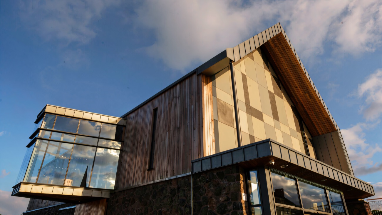 The building's angular roofline against a bright sky.