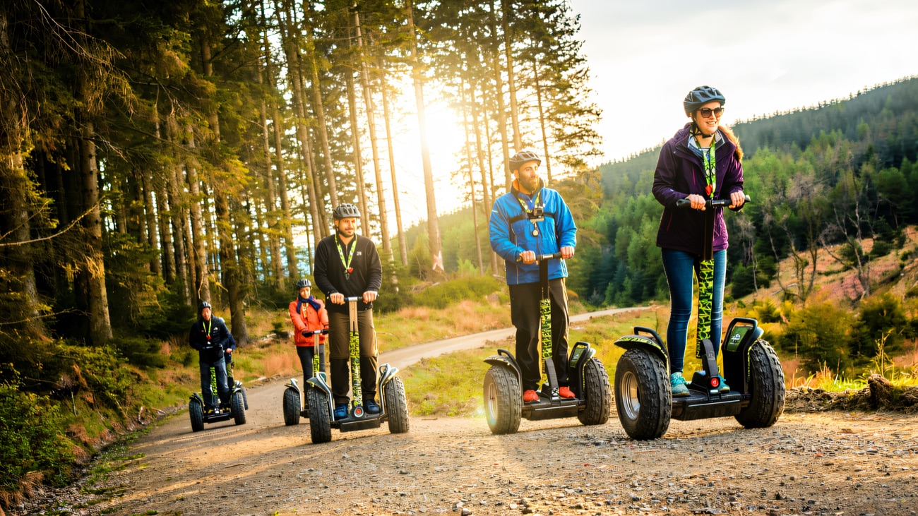 Rolling out along the forest trail on a full off-road Segway convoy