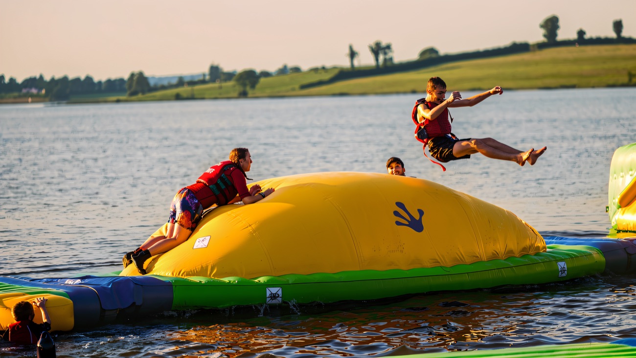 Launching skyward off the water blob on the aqua park