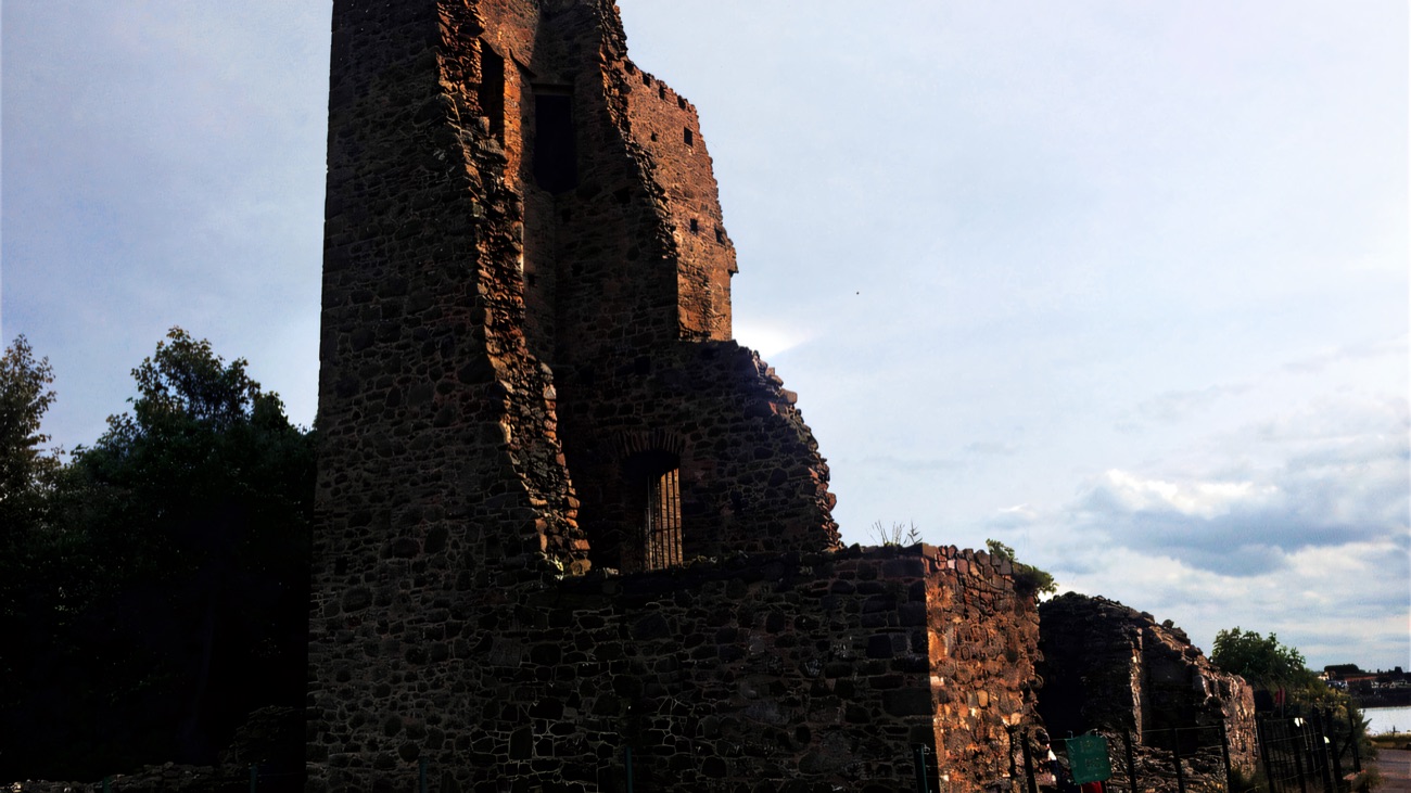The tall broken tower rising beside the shore of Strangford Lough.