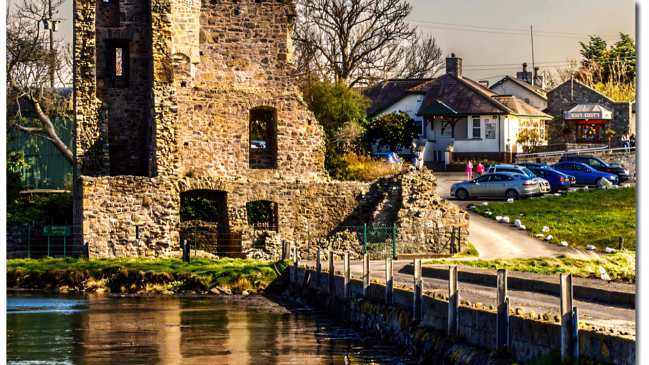 The ruin mirrored in still water by the causeway at Whiterock.