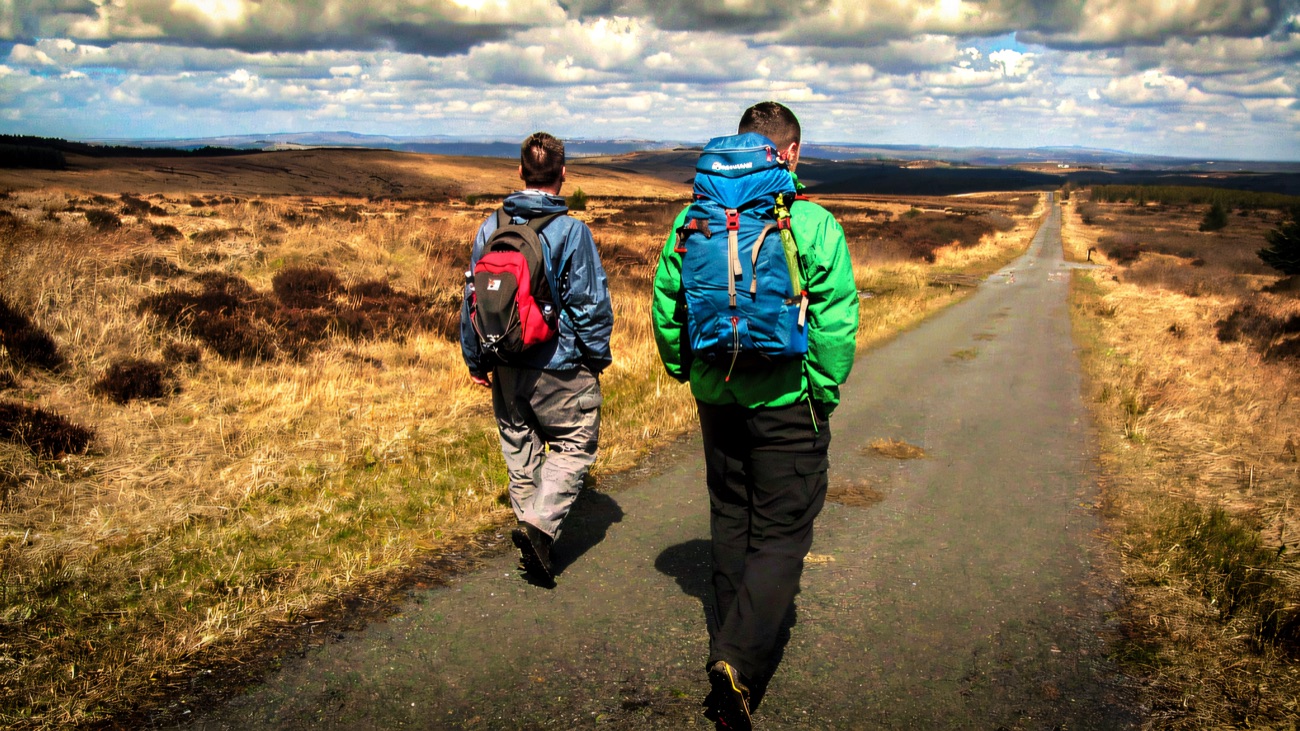 A quiet moorland road stretching across the wide blanket bog