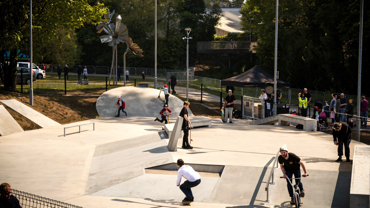 Busy opening day at the concrete park, with skaters, scooters and BMX riders out