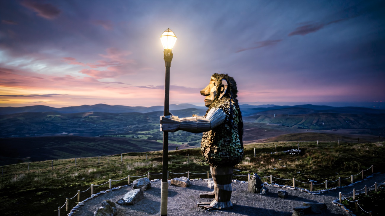 Darach the Guardian at dusk, his crystal-topped staff catching the last light over the Sperrins.