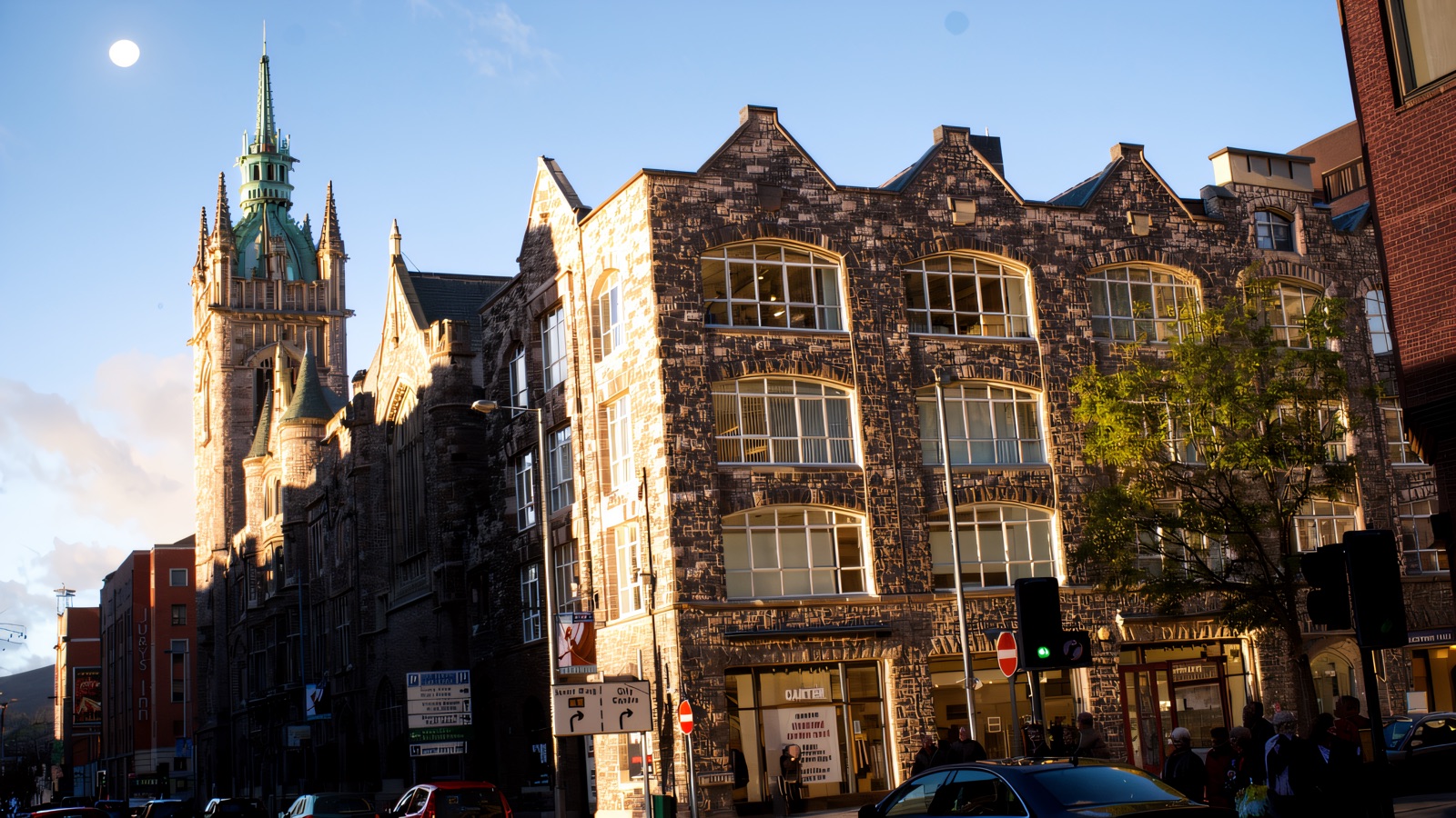 Church House, Belfast — the 1905 Presbyterian Assembly Buildings with its green-copper clock tower against a blue sky on Fisherwick Place