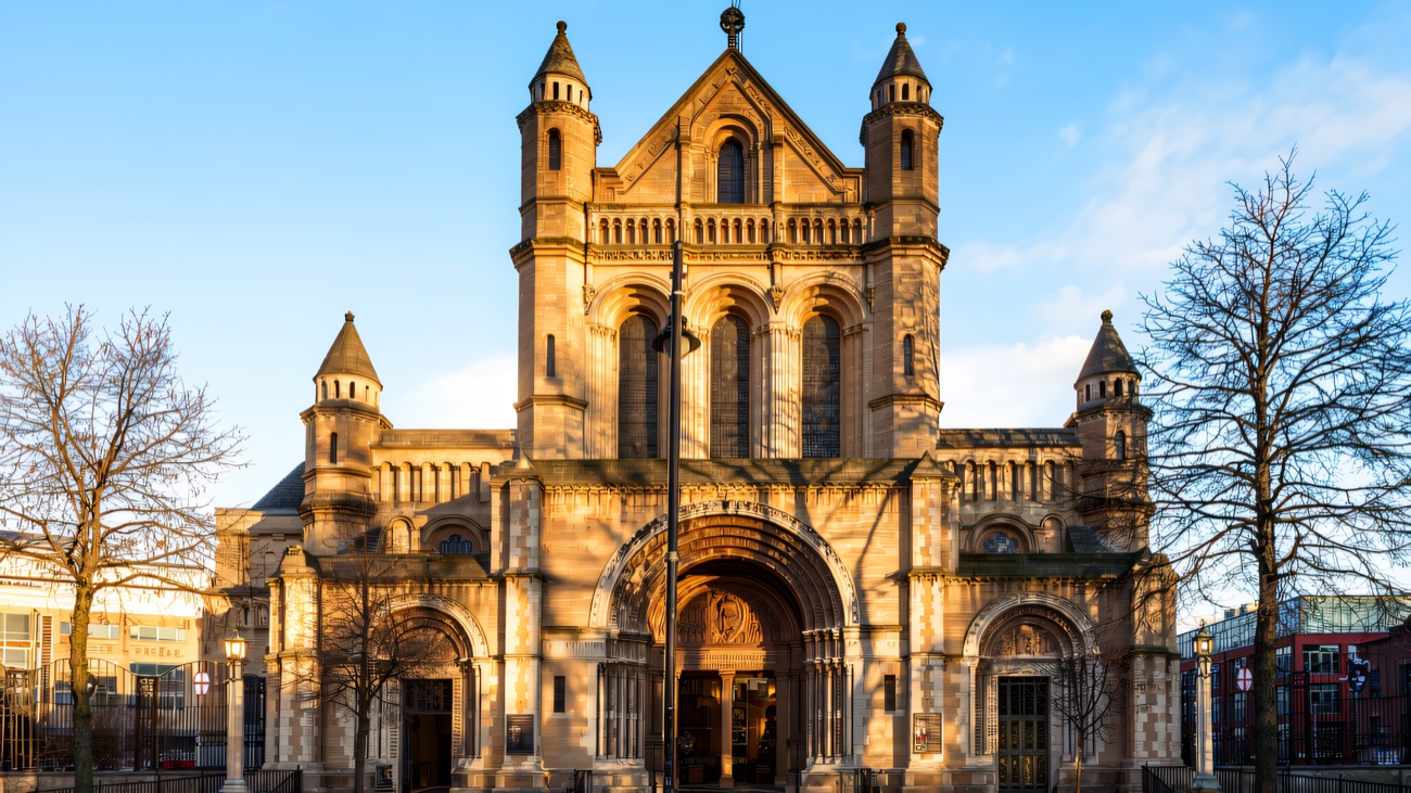 The Romanesque west front of the cathedral, warm in low sun.