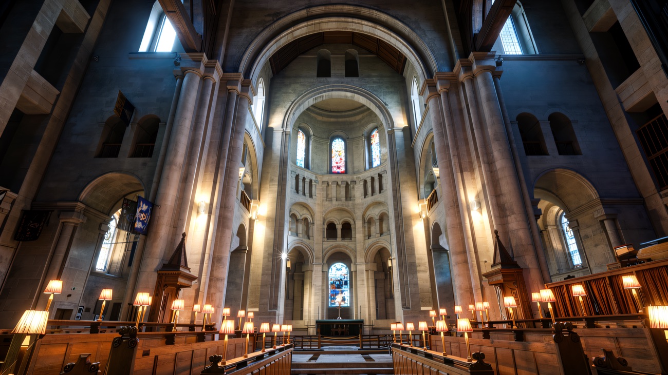 The apse and choir at dusk, lamps lit and stained glass aglow.