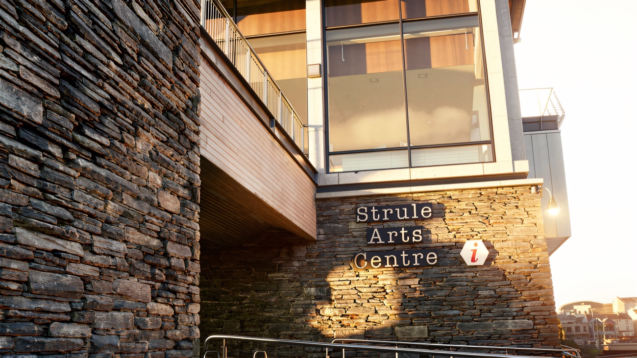 Strule Arts Centre signage on the slate-clad wall