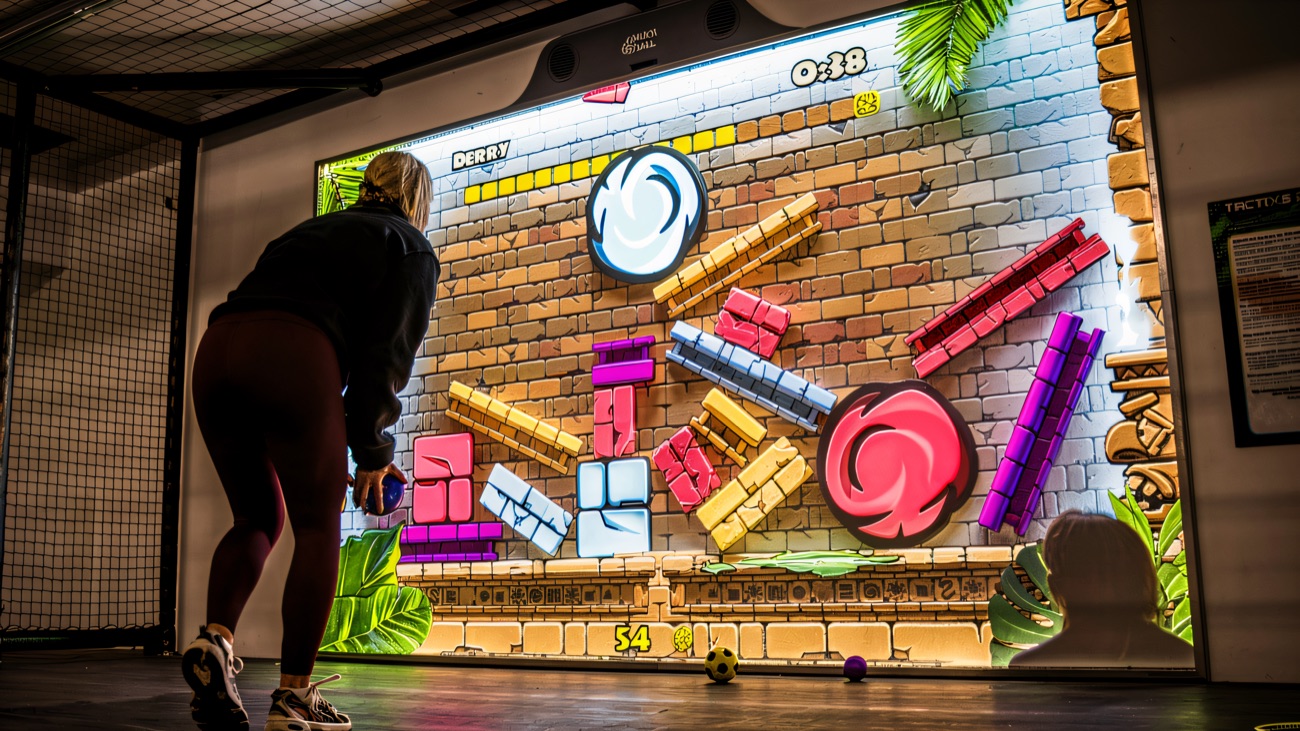 Diving into a game on the giant interactive projection wall