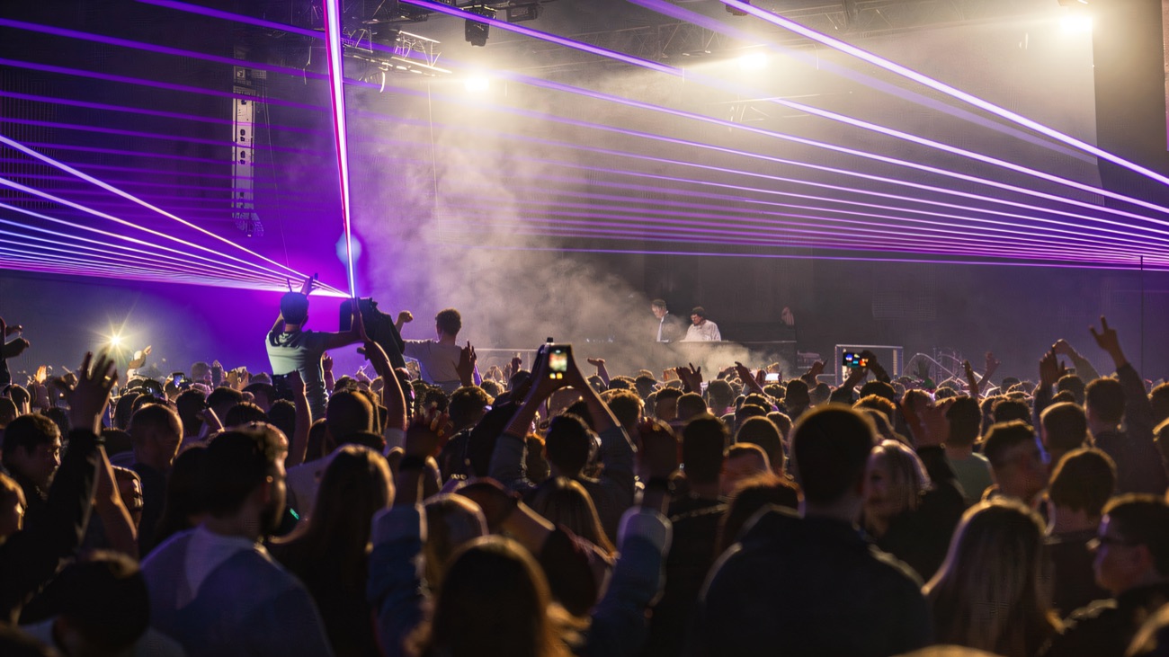 Lasers sweeping over the crowd in the main room