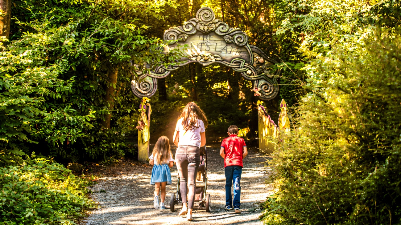 Following the carved storybook archway deeper into the woods