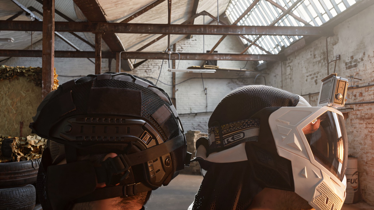 Two helmeted players inside the big steel-framed mill hall