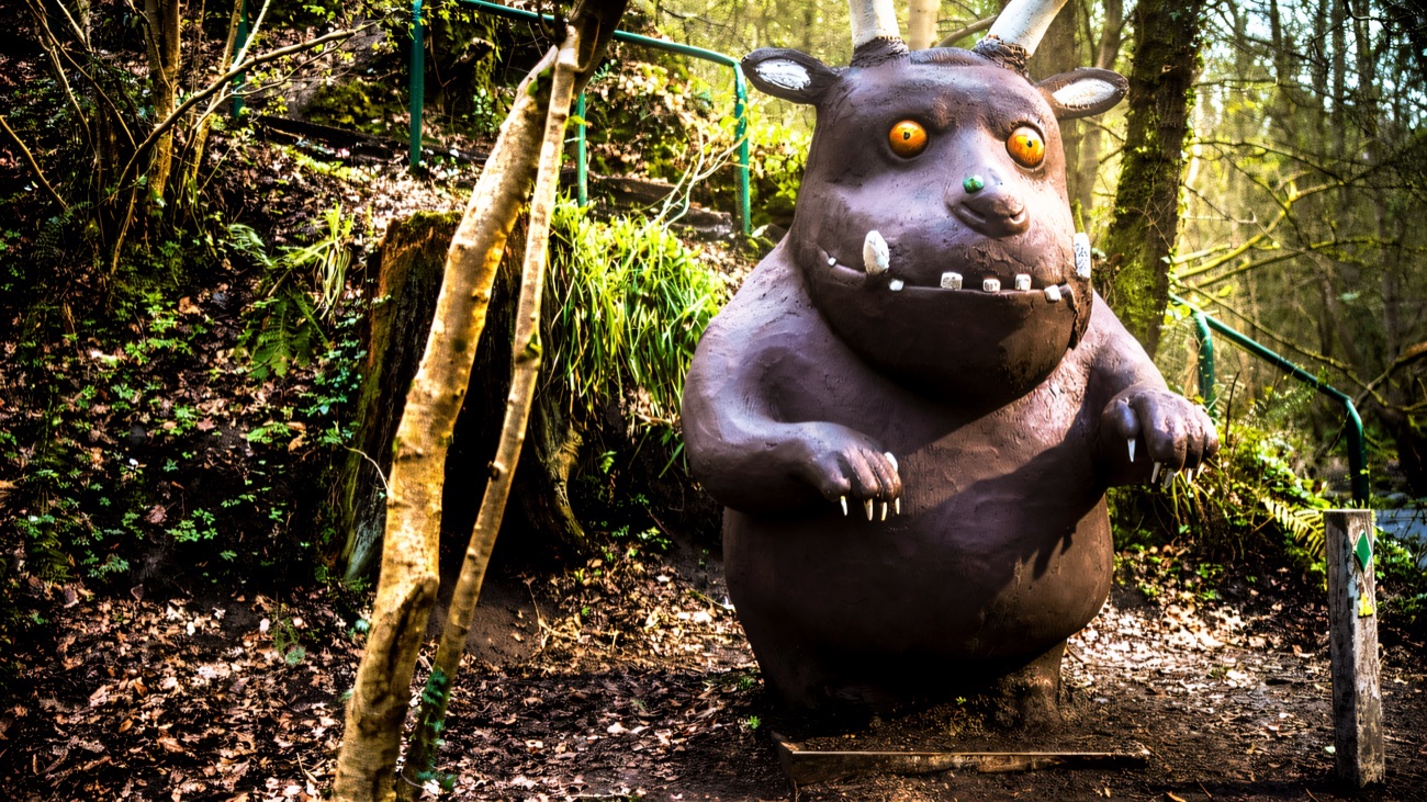The Gruffalo sculpture standing among the trees on the Gruffalo Trail at Colin Glen