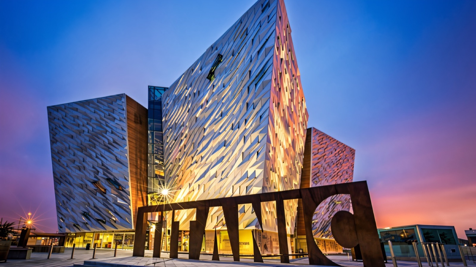 Titanic Belfast at sunset with the TITANIC letters