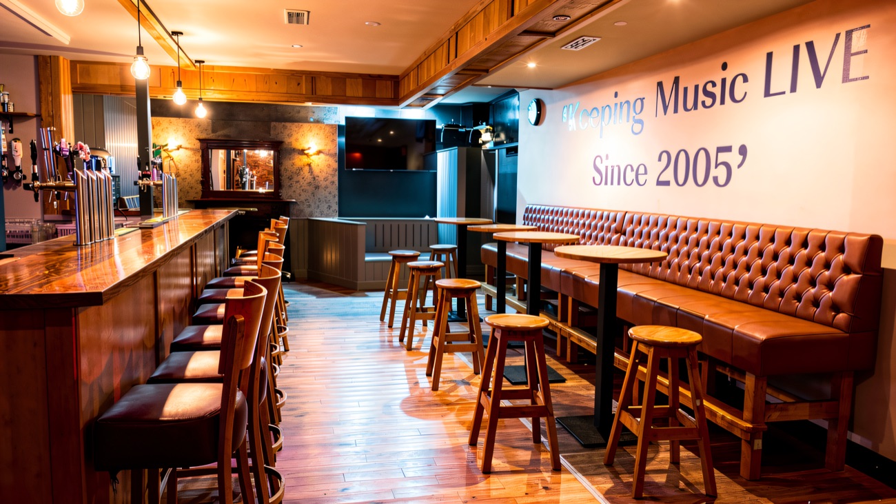 The main room, with Keeping Music LIVE Since 2005 painted across the wall