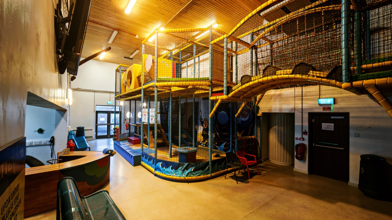 The pirate-themed multi-level play frame beside the reception desk