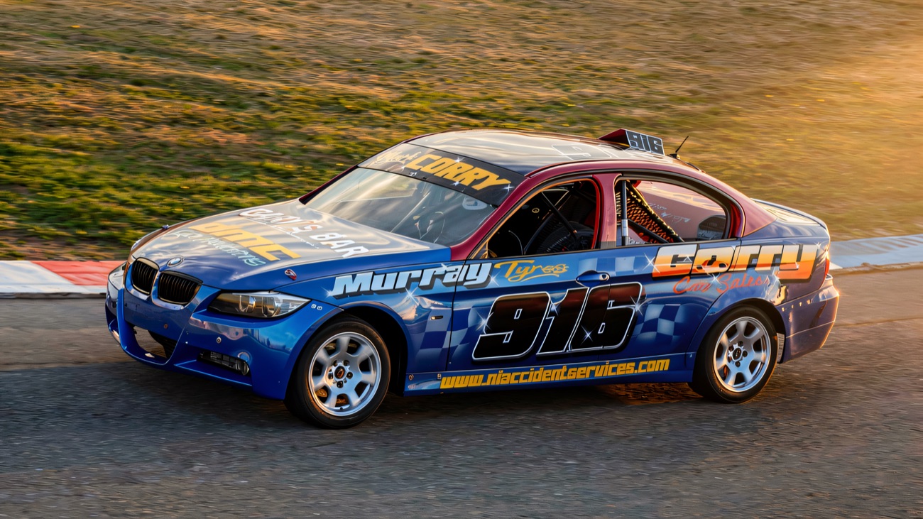 A saloon stock car powers round the Tullyroan bend
