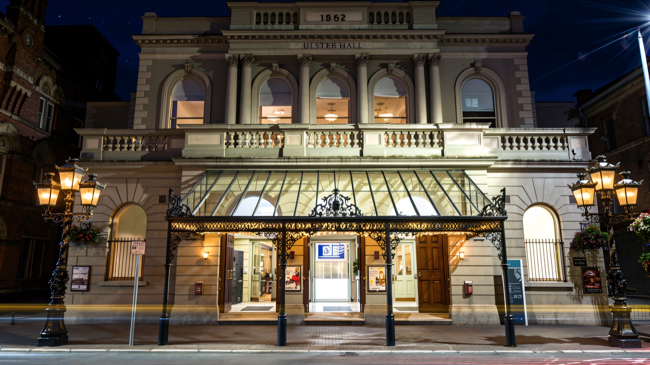 The floodlit Victorian facade of the Ulster Hall, built in 1862