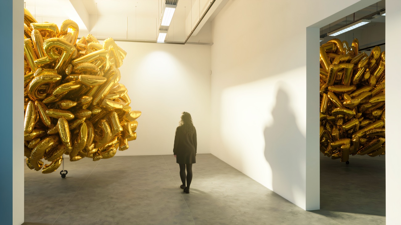 A gold balloon installation filling the gallery space