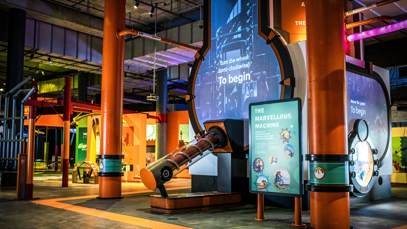 The Marvellous Machine gallery inside W5, with orange pillars and interactive screens