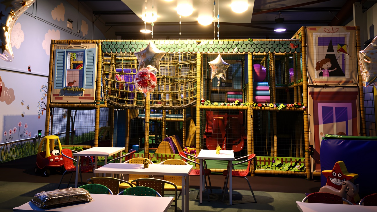 The soft play frame with café tables and chairs set out in front