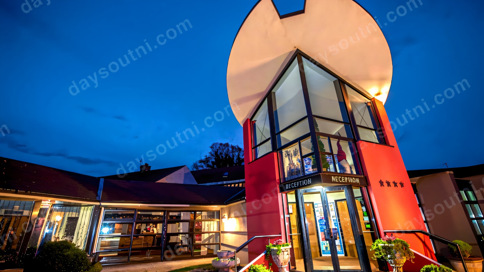 The White Horse Hotel's lit reception at dusk
