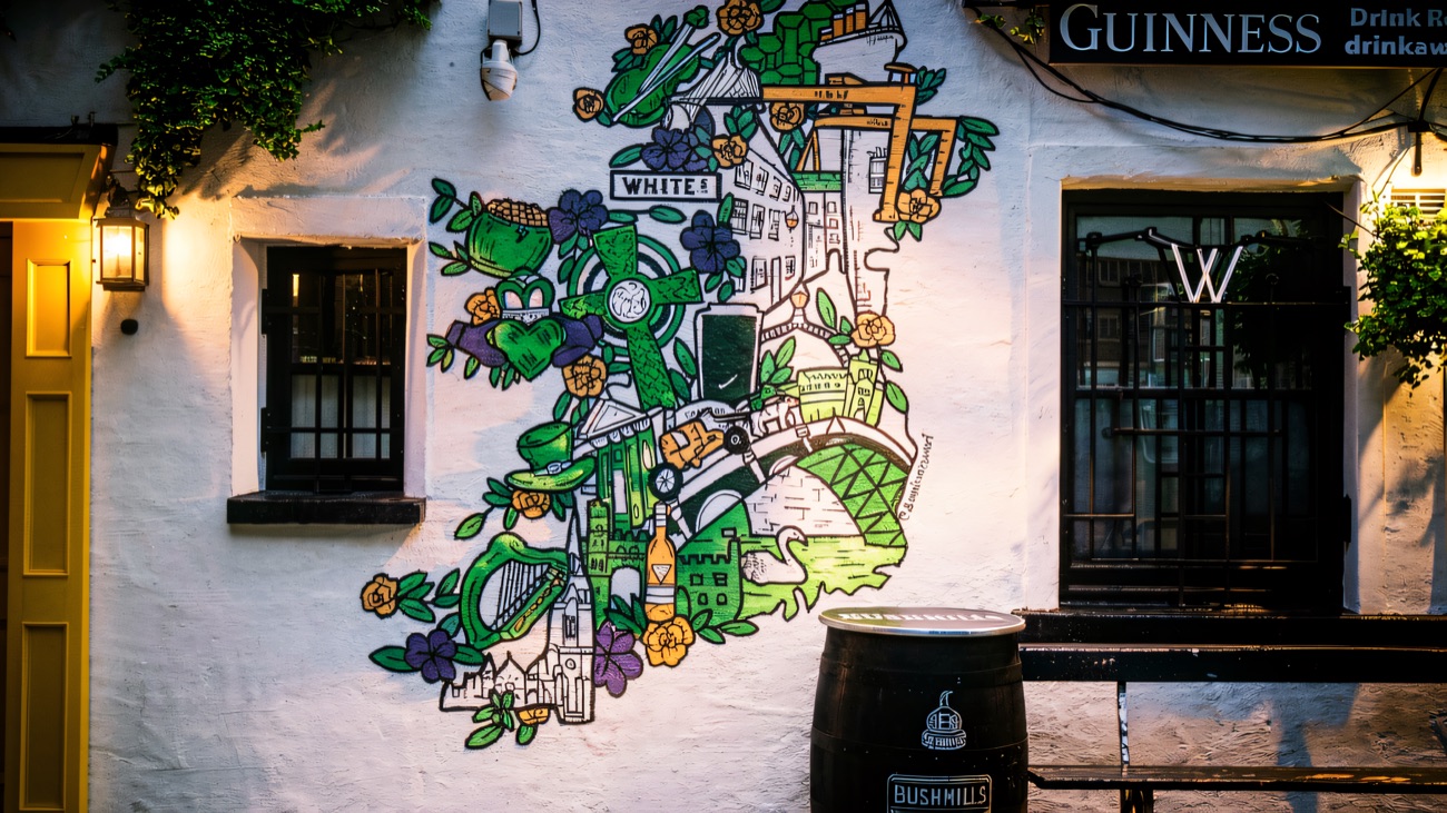 The painted map of Ireland on the courtyard wall beside the yellow door